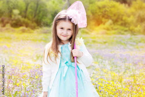 Photo: Little girl on the nature with butterfly net Little girl on the nature with butterfly net