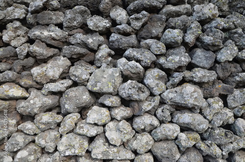 Photo: Etna's lava stones wall in a garden Etna's lava stones wall in a garden