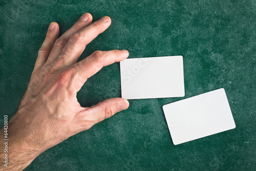Photo: Hand hold blank business card with rounded corners Hand hold blank business card with rounded corners