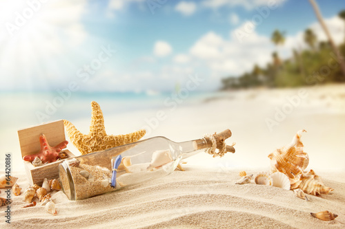 Photo: Summer beach with strafish and shells Summer beach with strafish and shells