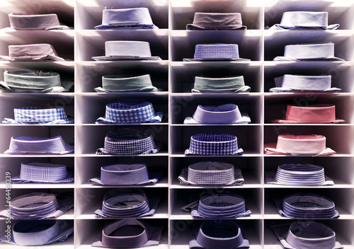 Photo: Folded colourful shirts on clothes rack Folded colourful shirts on clothes rack