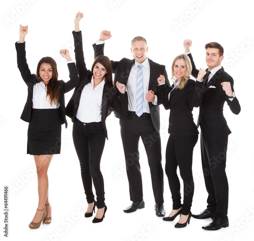 Photo: Successful Welldressed Businesspeople With Arms Raised Successful Welldressed Businesspeople With Arms Raised