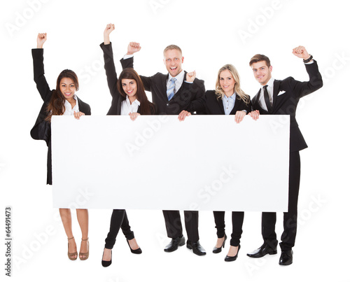 Photo: Confident Businesspeople Holding Blank Banner Confident Businesspeople Holding Blank Banner
