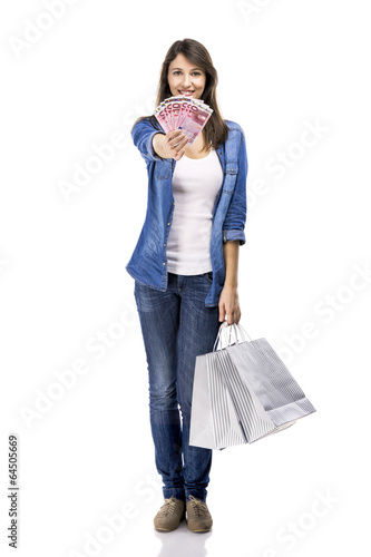 Photo: Beauitful woman holding some Euro currency notes Beauitful woman holding some Euro currency notes