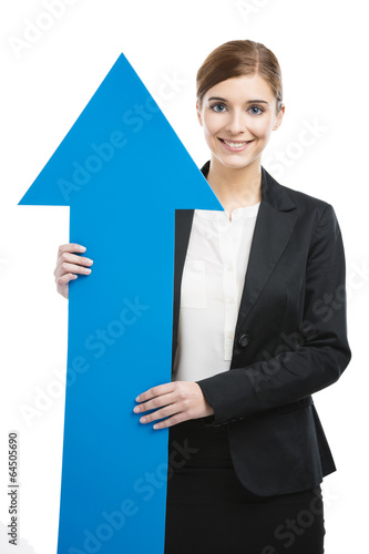 Photo: Business woman holding a blue arrow Business woman holding a blue arrow