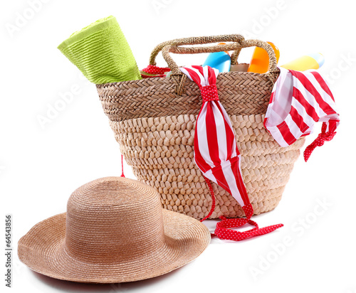 Photo: Wicker bag and swimsuit, isolated on white Wicker bag and swimsuit, isolated on white