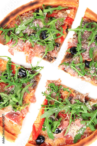 Photo: Pizza with arugula isolated on white Pizza with arugula isolated on white