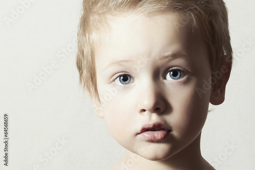 Photo: Child. Funny Little Boy. Handsome Boy with Blue Eyes Child. Funny Little Boy. Handsome Boy with Blue Eyes