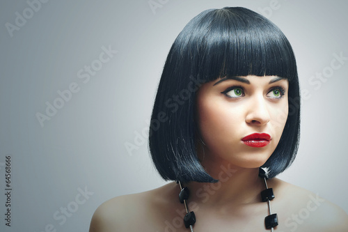 Photo: Beautiful Brunette Girl.bob Haircut. red lips. beauty woman Beautiful Brunette Girl.bob Haircut. red lips. beauty woman