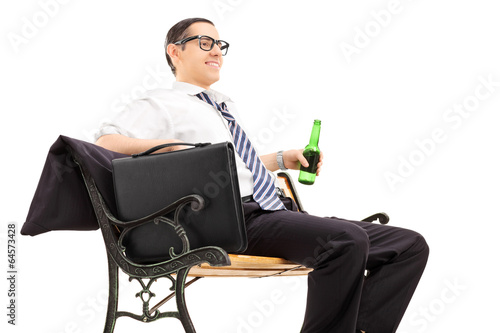 Photo: Businessman chilling out with a beer Businessman chilling out with a beer