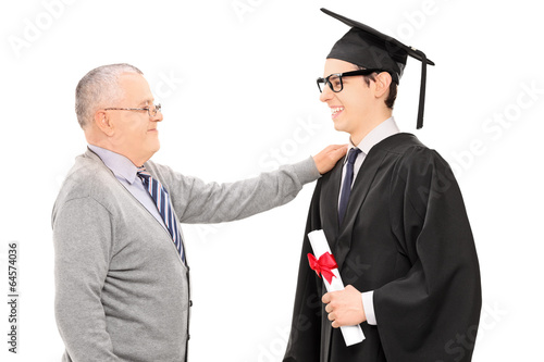 Photo: Father congratulates his son for graduating Father congratulates his son for graduating