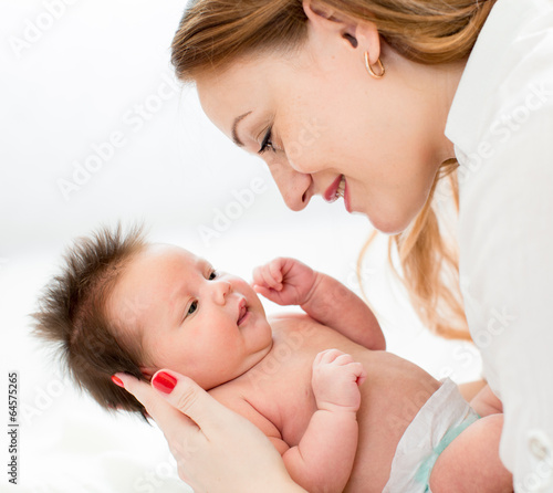 Photo: mom holding newborn baby infant mom holding newborn baby infant