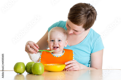 Photo: baby eating healthy food with mother baby eating healthy food with mother