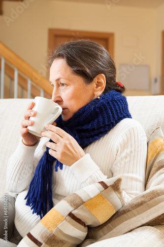 Photo: illness woman drinking hot tea illness woman drinking hot tea