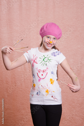 Photo: Painter girl in a decorated shirt Painter girl in a decorated shirt