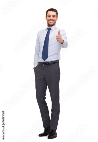 Photo: handsome businessman showing thumbs up handsome businessman showing thumbs up