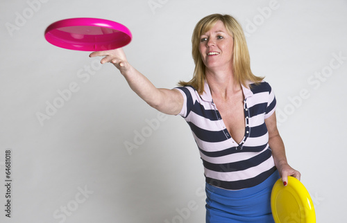 Photo: Woman throwing a frisbee disc Woman throwing a frisbee disc