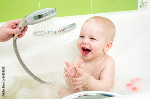 Photo: baby taking bath and douche baby taking bath and douche
