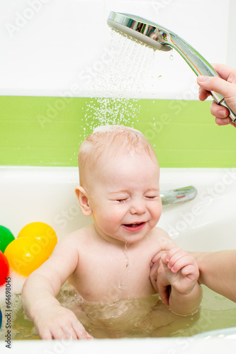 Photo: baby taking bath with tempering douche baby taking bath with tempering douche