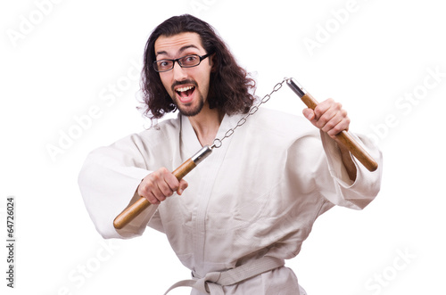 Photo: Karate man with nunchucks isolated on white Karate man with nunchucks isolated on white