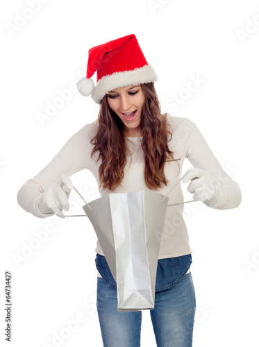 Photo: Attractive casual girl with Christmas hat shopping Attractive casual girl with Christmas hat shopping