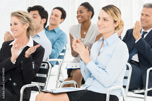 Photo: Group Of Businesspeople Clapping In Seminar Group Of Businesspeople Clapping In Seminar