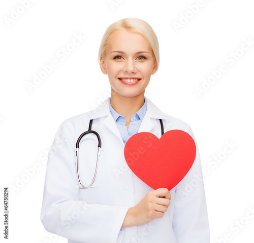 Photo: smiling female doctor with heart and stethoscope smiling female doctor with heart and stethoscope