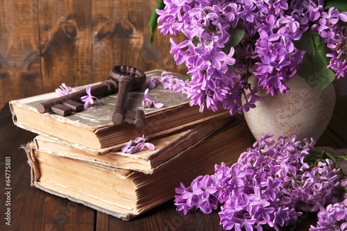 Photo: Beautiful composition with old keys and old books Beautiful composition with old keys and old books