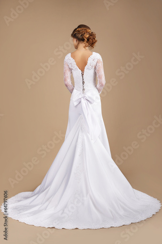 Photo: Holiday. Rear View of Auburn Woman in Long Festive Dress Holiday. Rear View of Auburn Woman in Long Festive Dress