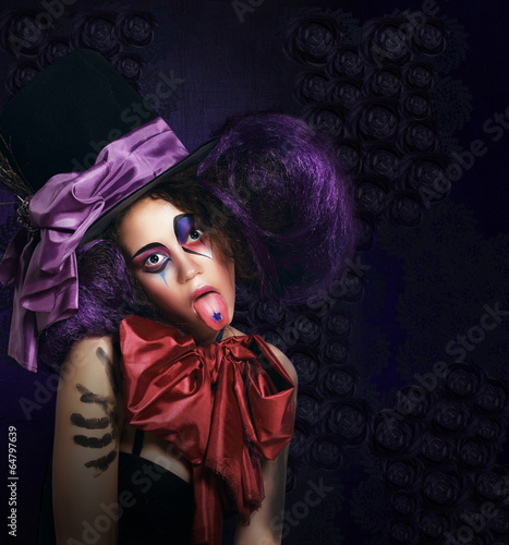 Photo: Burlesque. Humorous Comedian in Stagy Hat Showing Tongue Burlesque. Humorous Comedian in Stagy Hat Showing Tongue