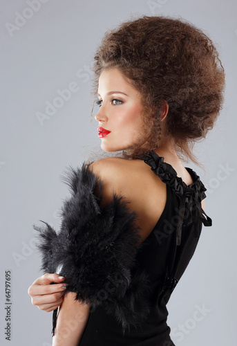 Photo: Glamorous Brunette with Frizzy Hairs in Evening Dress Glamorous Brunette with Frizzy Hairs in Evening Dress
