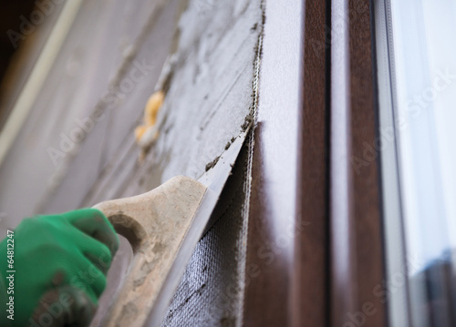 Photo: Man plastering Man plastering