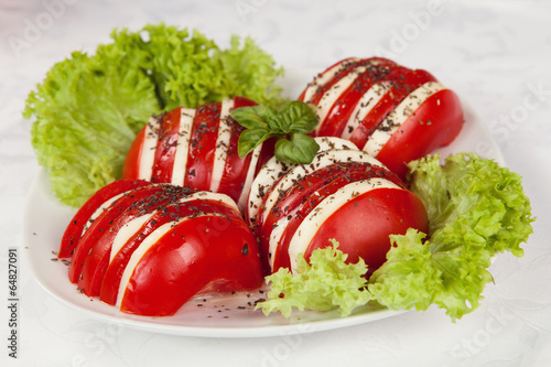 Photo: Caprese salad with mozzarella, tomato, basil and balsamic vinega Caprese salad with mozzarella, tomato, basil and balsamic vinega