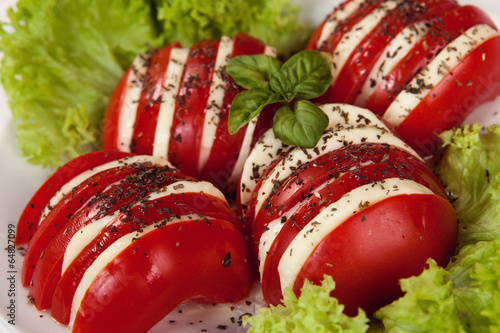 Photo: Caprese salad with mozzarella, tomato, basil and balsamic vinega Caprese salad with mozzarella, tomato, basil and balsamic vinega