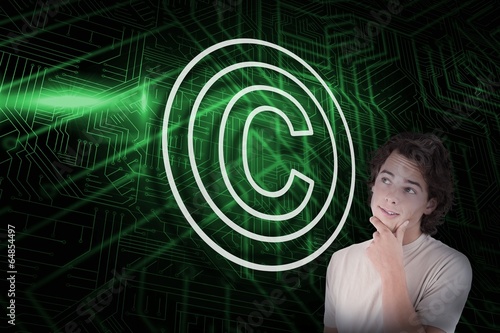 Photo: Composite image of copyright symbol and thinking casual man Composite image of copyright symbol and thinking casual man
