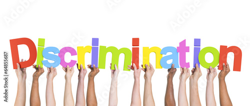 Photo: Diverse Hands Holding the Word Discrimination Diverse Hands Holding the Word Discrimination