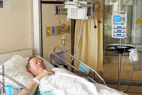 Senior man in hospital bed - 64860211