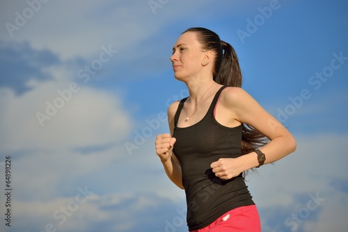 Photo: Young Woman Jogging Young Woman Jogging