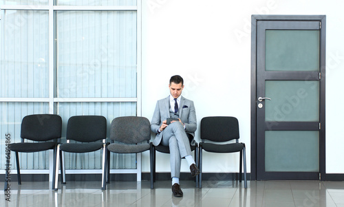 Photo: Business man waiting for job interview Business man waiting for job interview