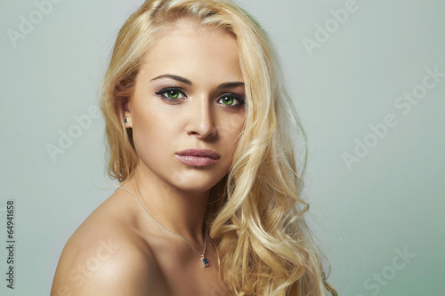 Photo: young woman.beautiful blond girl.Curly hair.toned young woman.beautiful blond girl.Curly hair.toned