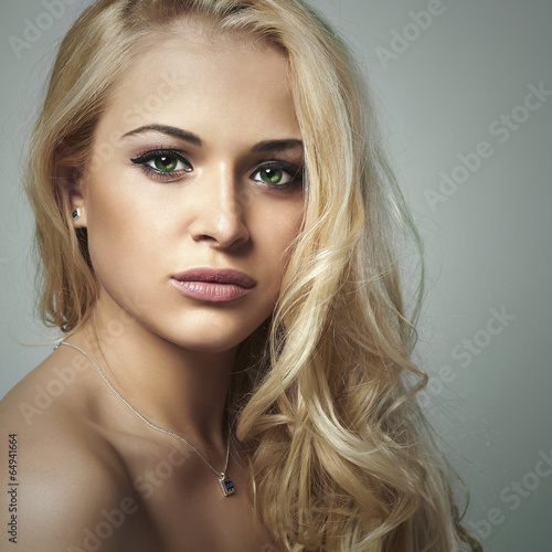 Photo: young woman.beautiful blond girl with green eyes.skin care young woman.beautiful blond girl with green eyes.skin care