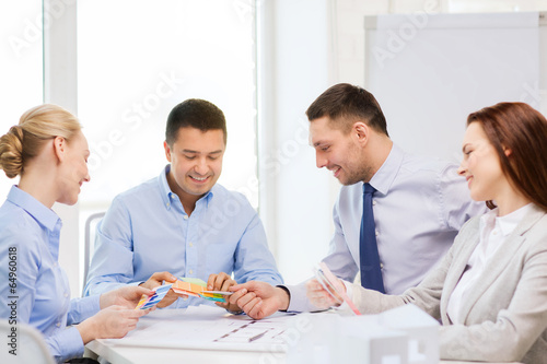Photo: happy team of architects and designers in office happy team of architects and designers in office