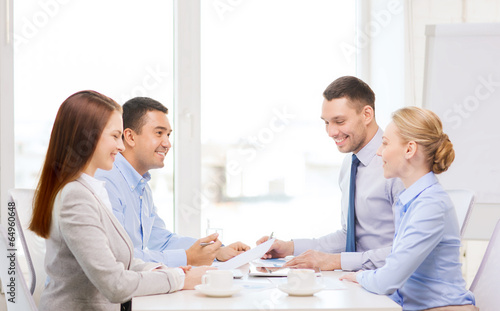 Photo: business team having meeting in office business team having meeting in office