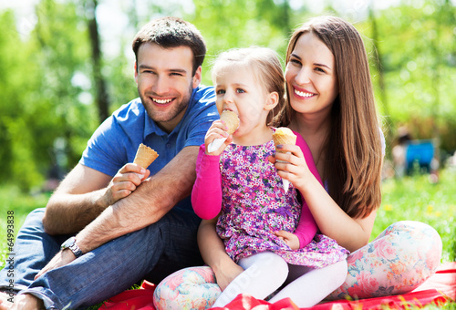 Photo: Happy family eating ice cream Happy family eating ice cream