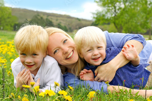 Photo: Happy Mother and Children Playing Outside Happy Mother and Children Playing Outside