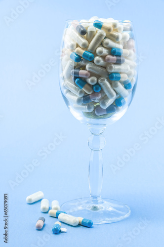 Photo: Pills in wine glass Pills in wine glass