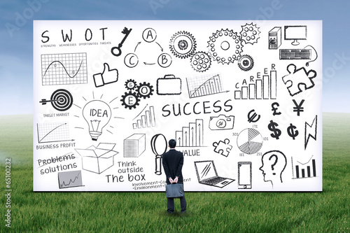 Photo: Businessman looking at business strategy Businessman looking at business strategy