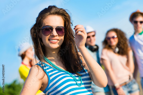 Photo: stylish young woman in sunglasses stylish young woman in sunglasses