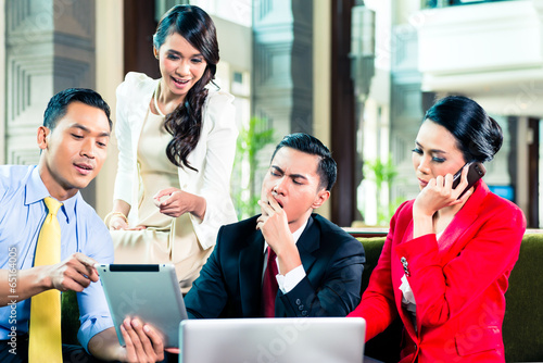 Photo: Asian businesspeople having meeting Asian businesspeople having meeting