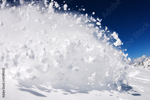 Photo: Snowboarder moving down Snowboarder moving down
